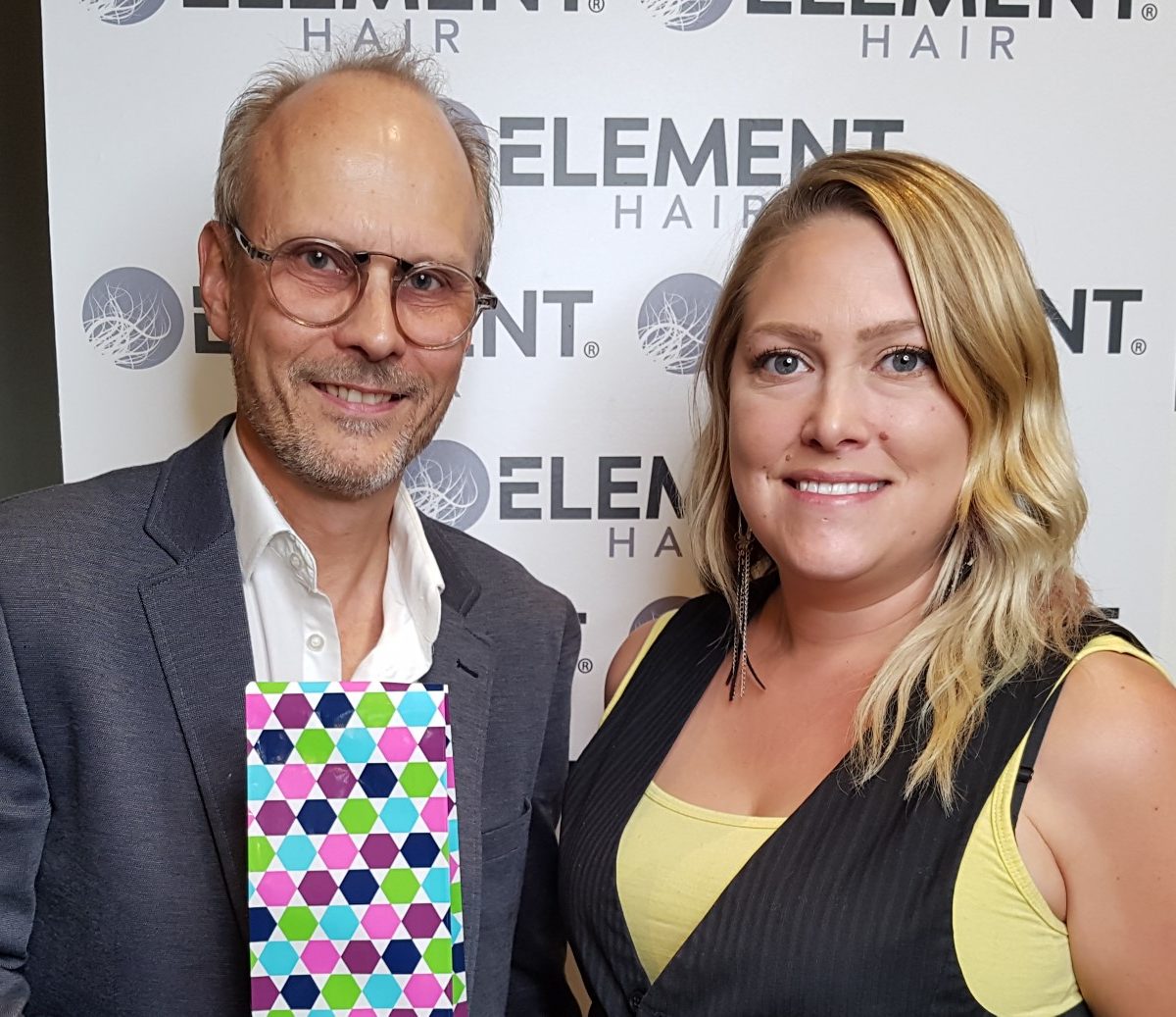 Kristie's 4 year Anniversary with Element Hair! (Left) Lance Nielsen, co-owner and director, presents (right) Kristie with a gift in recognition of her achievement.